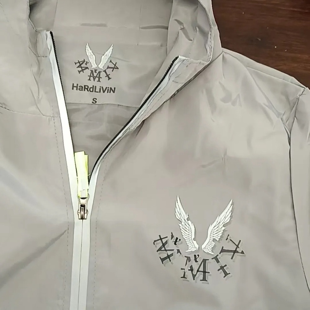 Weather the storm windbreaker with reflective stitching  almost sold out